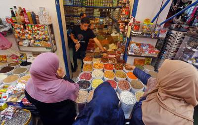 Libyans buy food products at a market as residents of the capital Tripoli get ready for the beginning of the fasting month of Ramadan. AFP