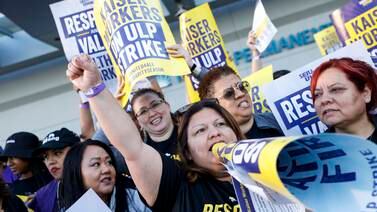 Healthcare workers on the picket line outside Kaiser Permanente Los Angeles Medical Centre in California. EPA