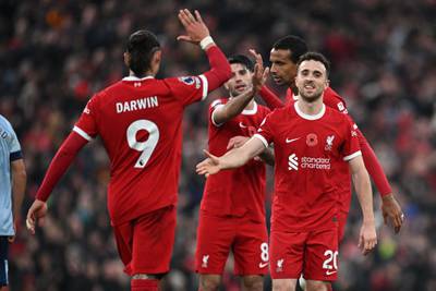 Diogo Jota celebrates with teammates after scoring Liverpool's third goal. AFP