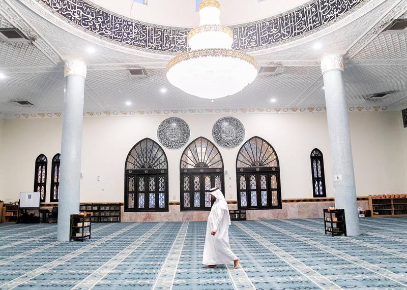 DUBAI, UNITED ARAB EMIRATES. 12 MAY 2020. The Imam of Port Saeed Masjid in Al Muraqqabat has called for Maghreb prayer. With no prayes allowed at mosques now, he’ll close the doors and head to iftar with his family.(Photo: Reem Mohammed/The National)Reporter:Section: