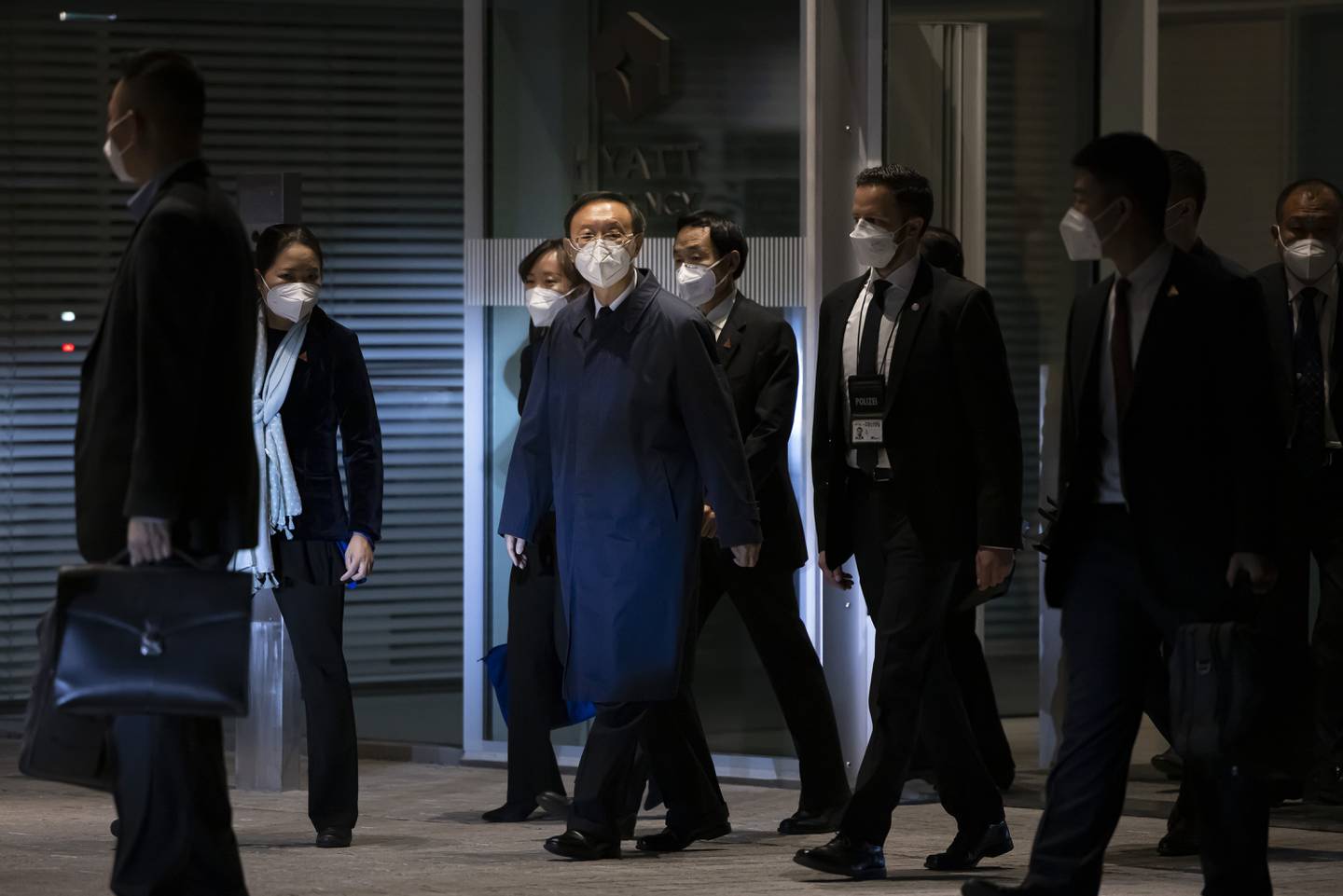 Senior Chinese foreign policy adviser Yang Jiechi and his delegation leave the Hyatt hotel at Zurich Airport, Switzerland, on October 6, 2021.   AP