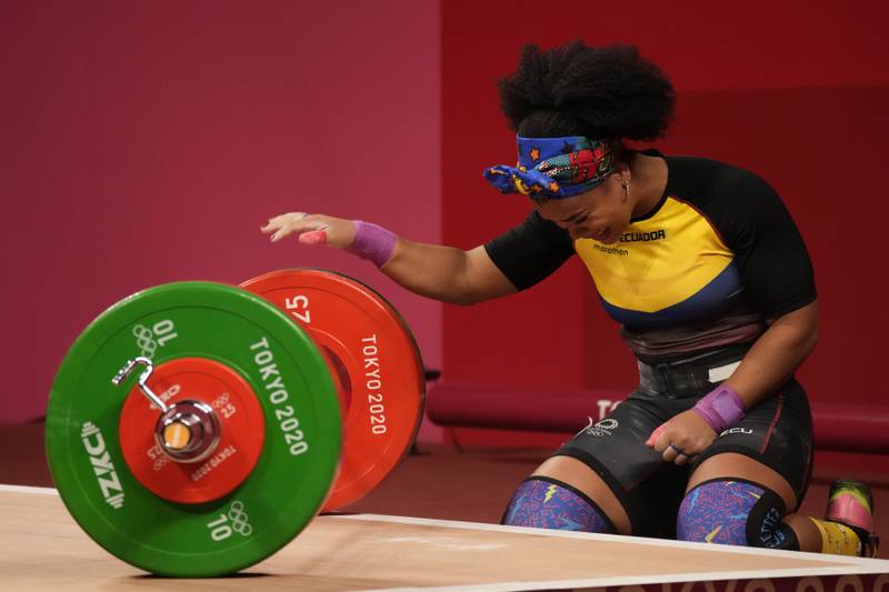Neisi Patricia Dajomes Barrera of Ecuador celebrates after winning gold in the women's 76kg weightlifting.