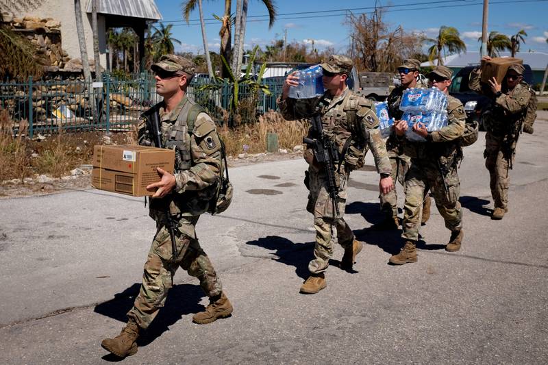 Soldiers arrive at the Matlacha-Pine Island fire control district with much-needed supplies. Reuters