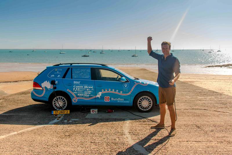 Wiebe Wakker celebrates reaching Darwin in Australia in his electric Volkswagen on day 827 of his road trip. Plug Me In