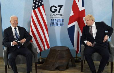 Britain's Prime Minister Boris Johnson (R) and US President Joe Biden and react during a bi-lateral meeting at Carbis Bay, Cornwall on June 10, 2021, ahead of the three-day G7 summit being held from 11-13 June.  G7 leaders from Canada, France, Germany, Italy, Japan, the UK and the United States meet this weekend for the first time in nearly two years, for the three-day talks in Carbis Bay, Cornwall. - 
 / AFP / Brendan Smialowski
