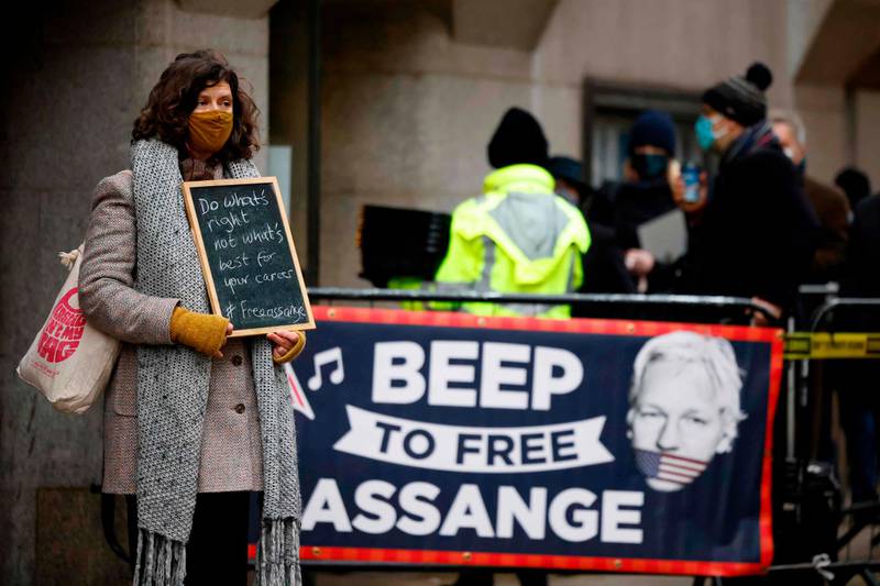Supporters of Wikileaks founder Julian Assange demonstrate outside the Old Bailey. AFP