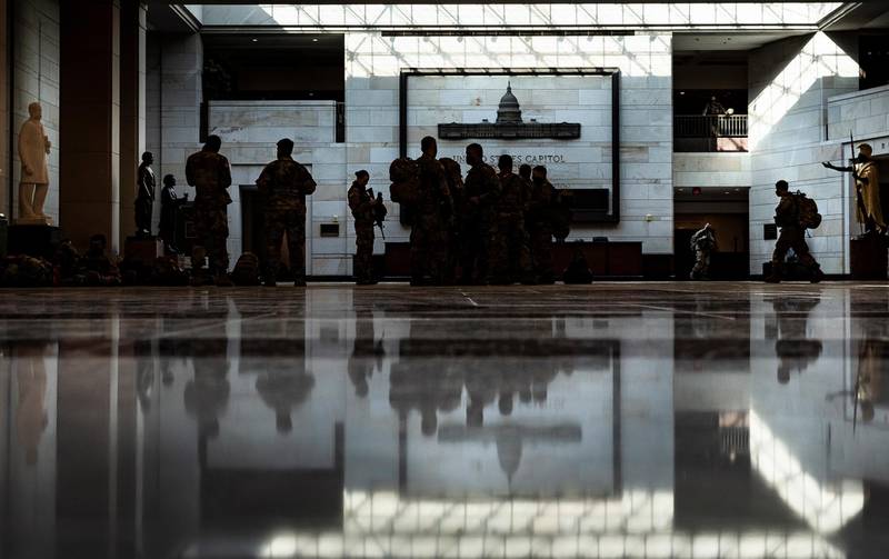 National Guard soldiers gather in the visitors center of the US Capitol building. EPA