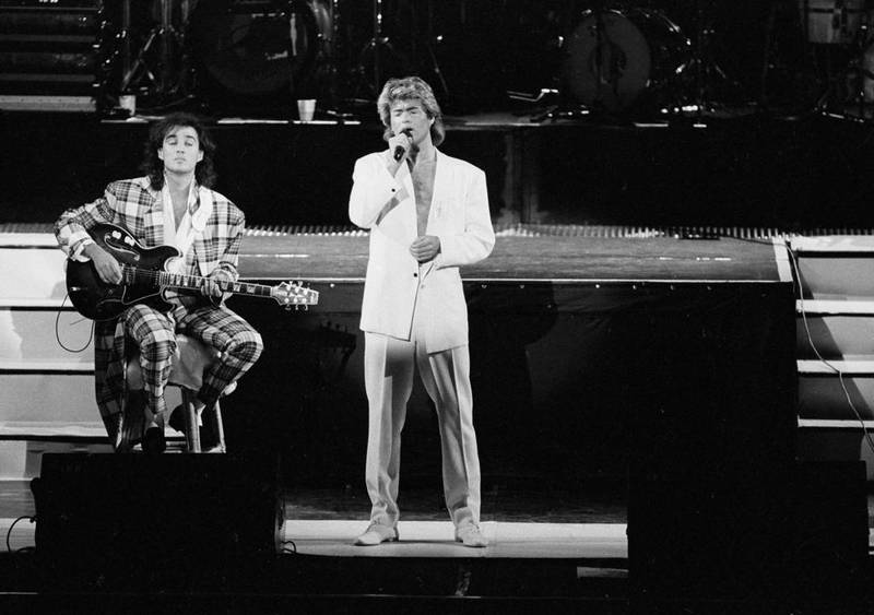 Andrew Ridgeley and George Michael of Wham! perform during a concert in Beijing, China, on April 7, 1985. AP