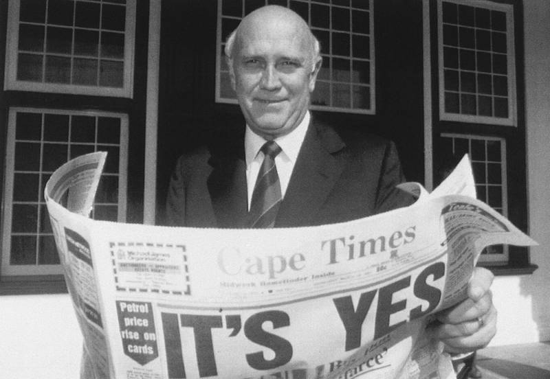 South African President FW  de Klerk outside his office in Cape Town, in 1992 with a copy of a local newspaper with a banner headline declaring a 'Yes' result in a referendum vote to end apartheid and share power with the black majority for the first time. AP Photo