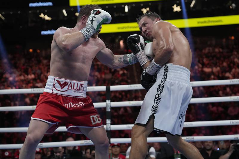 Canelo Alvarez throws a punch at Gennady Golovkin during their super middleweight title fight. AP