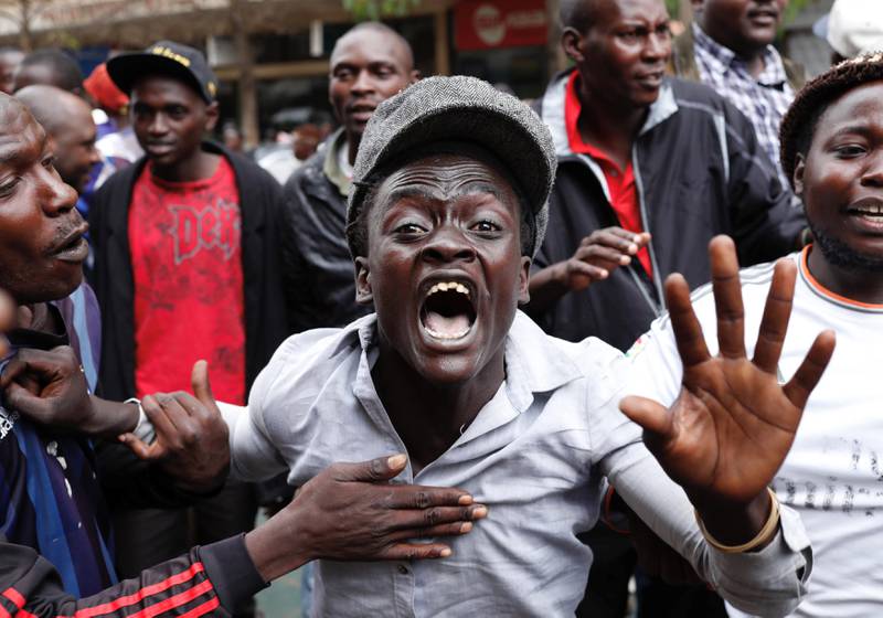 Supporters of Kenyan President Uhuru Kenyatta shout in front of the Supreme Court in Nairobi, Kenya. Goran Tomasevic / Reuters