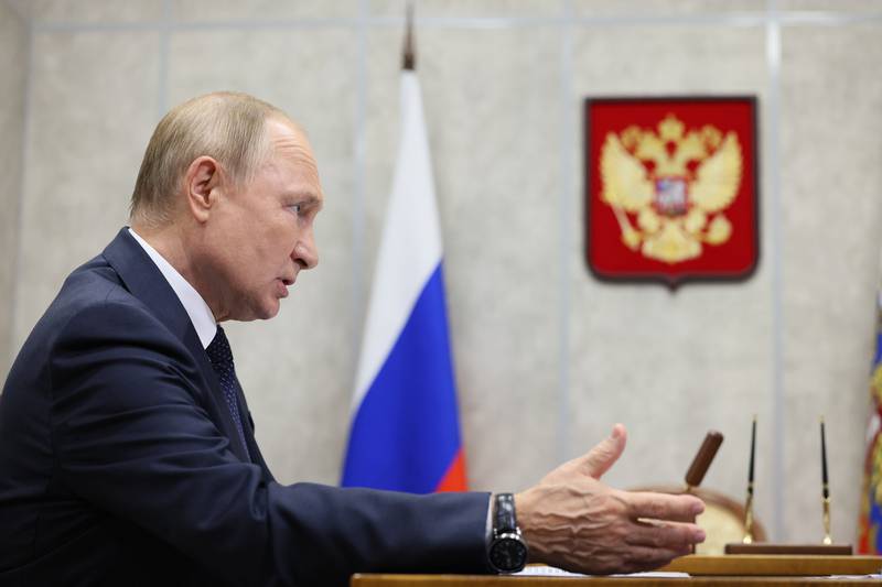 Russian President Vladimir Putin meets officials in the city of Veliky Novgorod on Wednesday. AP Photo