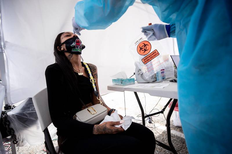 Deasia is administered a Covid-19 test at the St John's Well Child and Family Centre mobile Covid-19 clinic set up amid the pandemic in Los Angeles, California, US.  EPA