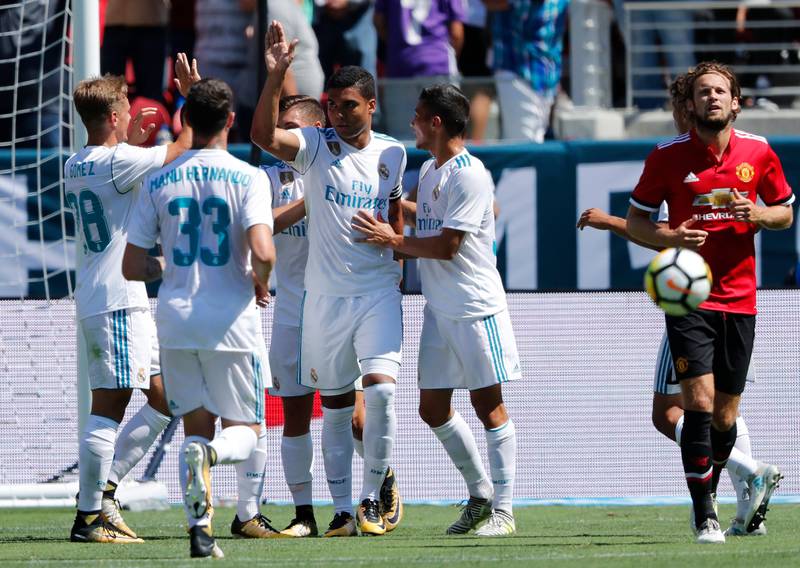 Real Madrid midfielder Casemiro, centre, is greeted by teammates after scoring against Manchester United during the second half of the International Champions Cup match at Levi's Stadium in Santa Clara, California, USA, 23 July 2017. Manchester United defeated Real Madrid in the penalty shoot-out. John G Mabanglo / EPA