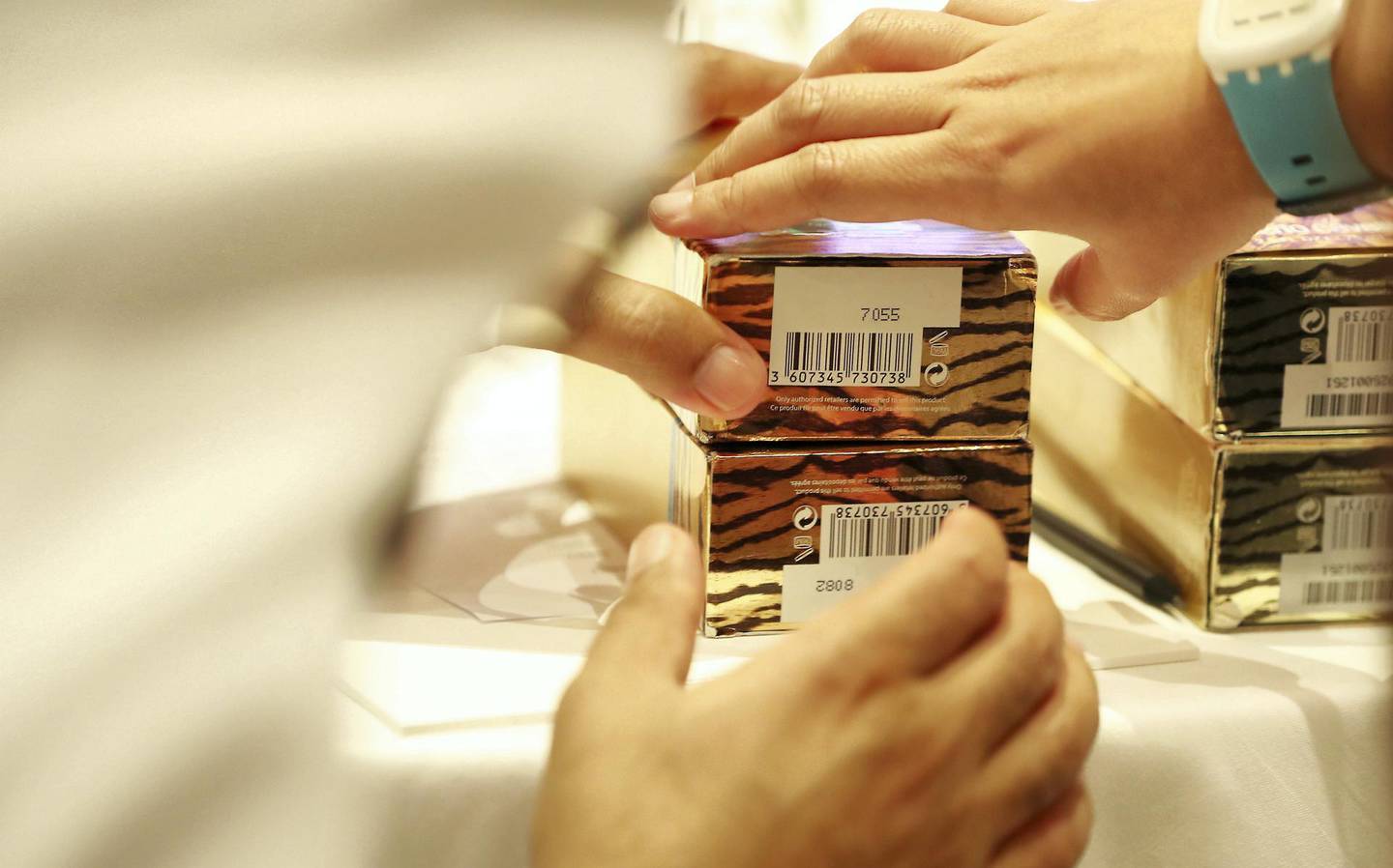 ABU DHABI, UNITED ARAB EMIRATES , Dec 10 – 2019 :- Member of the Abu Dhabi Police looking at the real and counterfeit cosmetic items during the Intellectual Property and Brand Protection Training held at The Abu Dhabi EDITION hotel at Al Bateen Marina in Abu Dhabi ( Pawan Singh / The National )  For News. Story by Kelly Clarke 