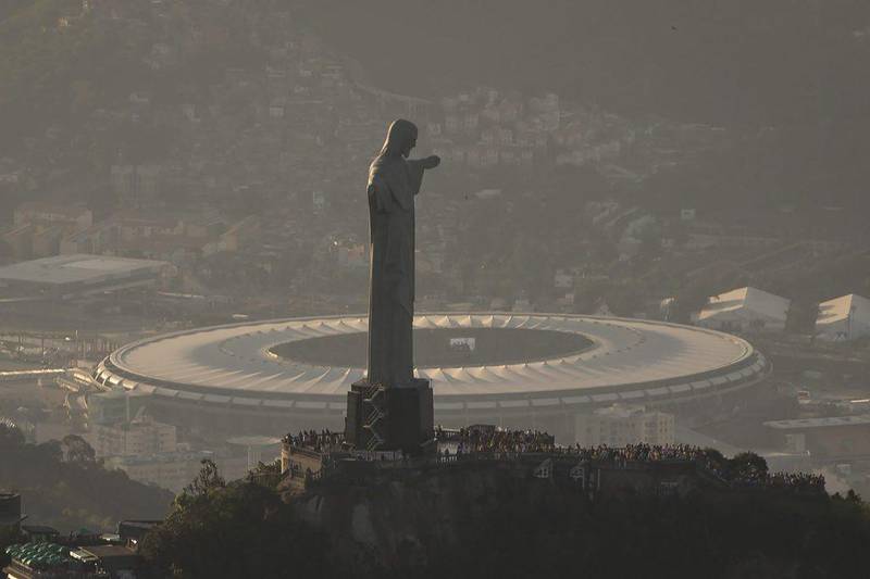 Aerial view of the Maracana Stadium, host of the World Cup opening match and 2014 World Cup Final, behind Rio de Janeiro's Christ the Redeemer statue ahead of the World Cup's kickoff on Thursday June 12, 2014. Felipe Dana / AP