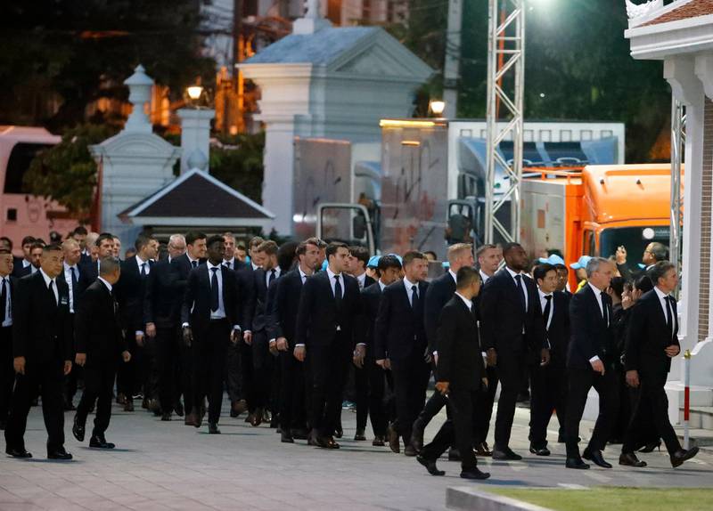 Leicester City's players and staff arrive to pay their respects. EPA