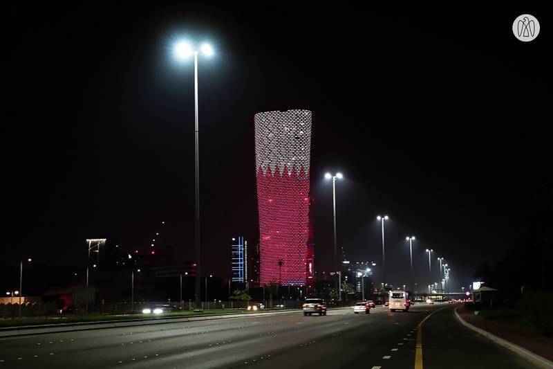 Adnec's Capital Gate building in Abu Dhabi is illuminated to mark Qatar National Day.