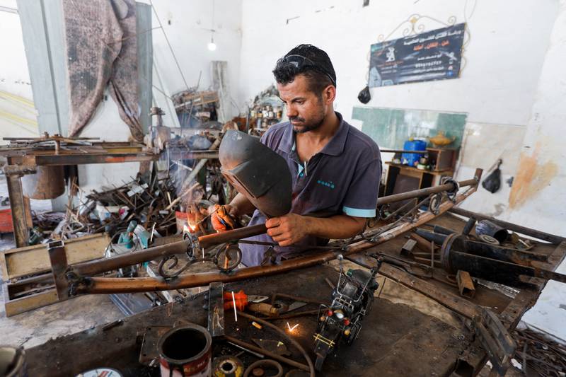 Hamad's old workshop had been destroyed when an Israeli plane bombed a nearby security post but he used the little aid he received to open another one.