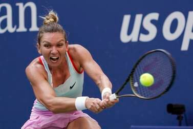 FILE - Simona Halep, of Romania, returns a shot to Daria Snigur, of Ukraine, during the first round of the U. S.  Open tennis championships Aug.  29, 2022, in New York.  Two-time Grand Slam champion Simona Halep has been suspended from professional tennis for four years for alleged doping violations, the International Tennis Integrity Agency said Tuesday, Sept.  12, 2023.  (AP Photo / Seth Wenig, File)