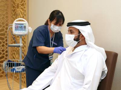 The director general of the National Emergency, Crisis and Disasters Management Authority, Obaid Al Shamsi, taking the vaccine. Wam