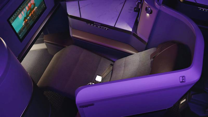 Business-class passengers on Etihad have reclining seats and can choose a la carte meals. Photo: Etihad Airways