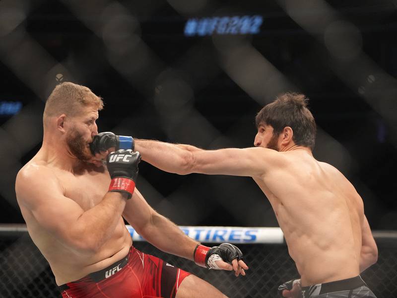 Magomed Ankalaev lands a jab on Jan Blachowicz during UFC 282 at T-Mobile Arena. USA Today