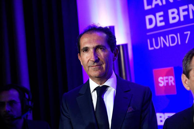 (FILES) In this file photo taken on November 07, 2016 Altice CEO Patrick Drahi looks on during the launch of the new television channel BFM Paris in Paris.  The billionaire announced on June 10, 2021 that he had acquired 12.1% of the capital of the British incumbent operator BT, becoming its largest shareholder, but assuring that he would not launch a takeover bid. / AFP / MARTIN BUREAU
