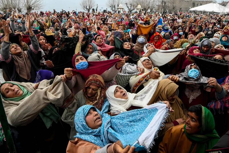 Muslims during the display of a relic, believed to be a hair from the Prophet Mohammed's beard, during Miraj-ul-Alam (ascension to heaven) celebrations at Kashmir's main Hazratbal shrine in Srinagar on Tuesday. AFP