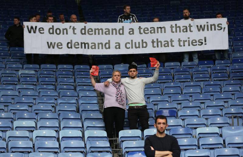 Newcastle fans protest at the club's owner's apparent lack of ambition. Alex Morton / Reuters