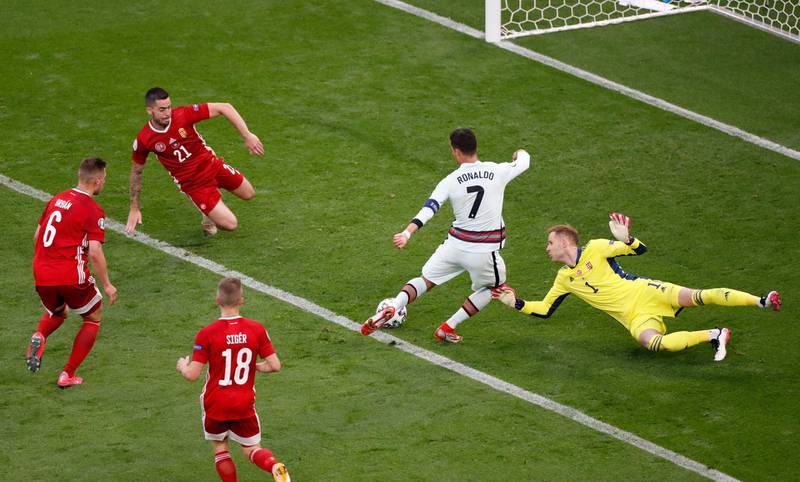 Cristiano Ronaldo rounds Hungary goalkeeper Peter Gulacsi before making it 3-0. Reuters