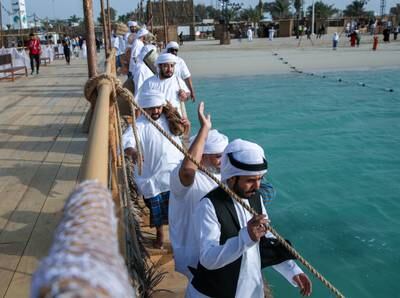 As they march, the pearl divers chant a lilting song against the seaborne breeze.