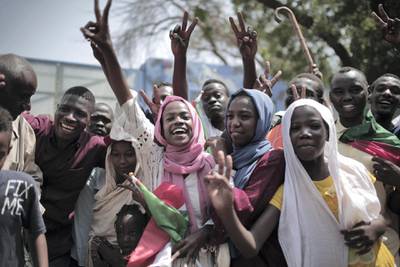 Sudanese men and women celebrate outside the Friendship Hall in the capital Khartoum where generals and protest leaders signed a historic transitional constitution meant to pave the way for civilian rule in Sudan, on August 17, 2019. - The constitutional declaration formalises the creation of a transition administration that will be guided by an 11-member sovereign council, comprised of six civilians and five military figures.
The agreement brought an end to nearly eight months of upheaval that saw masses mobilise against president Omar al-Bashir, who was ousted in April after 30 years in power. (Photo by Jean Marc MOJON / AFP)