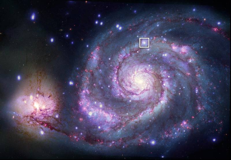 A composite image of M51 with X-rays from Chandra and optical light from Nasa's Hubble Space Telescope contains a box that marks the location of a possible planet. Photo: Nasa