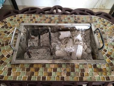 The indoor coal heater that was left burning in the women's room. Courtesy Dubai Police