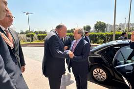 Egyptian Foreign Minister Sameh Shoukry, left, receives his Syrian counterpart Faisal Mekdad at the ministry headquarters in Cairo. Egyptian Foreign Ministry
