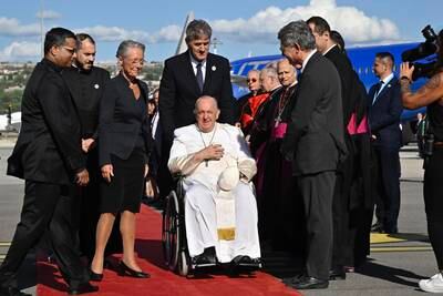 French Prime Minister Elisabeth Borne (third left) greets Pope Francis upon his arrival at Marseille Airport. EPA