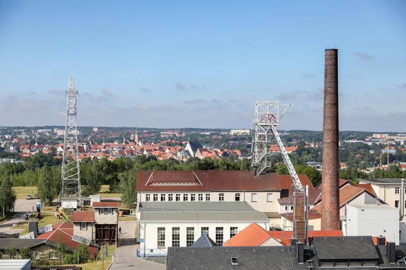 27 June 2019, Saxony, Freiberg: Panoramic view over the daily installations of the shaft "Reiche Zeche" of the colliery "Himmelfahrt Fundgrube" to the city Freiberg. Freiberg is the oldest and most important silver mining area in the Erzgebirge. The region applies for the title on the Saxon side with seventeen, on the Czech side with five parts. The selected monuments, natural and cultural landscapes represent the most important mining areas and epochs of Saxon-Bohemian ore mining as witnesses of 800 years of history. The pits "Reiche Zeche" and "Alte Elisabeth" are still used by the TU Bergakademie Freiberg as a teaching and research mine. Photo by: Jan Woitas/picture-alliance/dpa/AP Images