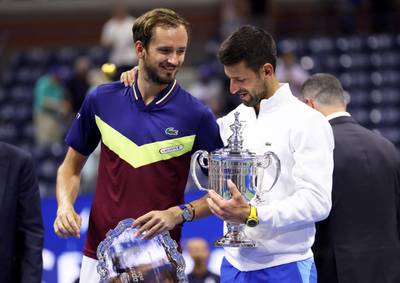 Novak Djokovic with Daniil Medvedev during the US Open trophy ceremony. Getty
