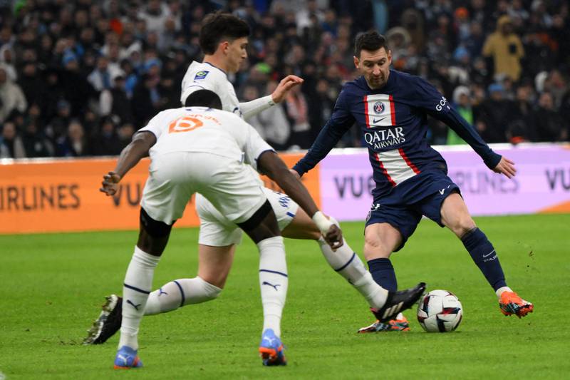 Paris Saint-Germain's Argentine forward Lionel Messi fights for the ball with Marseille's Argentine defender Leonardo Balerdi. AFP