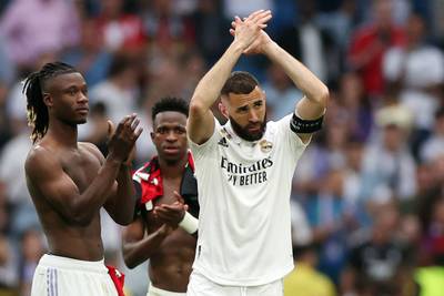 Real Madrid's French forward Karim Benzema applauds fans at the Bernabeu after it was earlier announced he would be leaving the club after 14 years. EPA