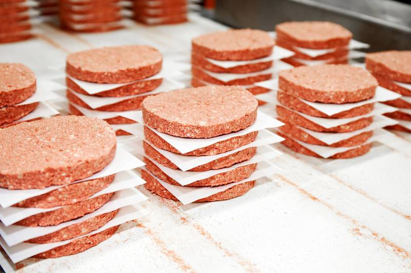 Freshly made meat-imitation burgers at the Impossible Foods factory. Courtesy of Impossible Foods