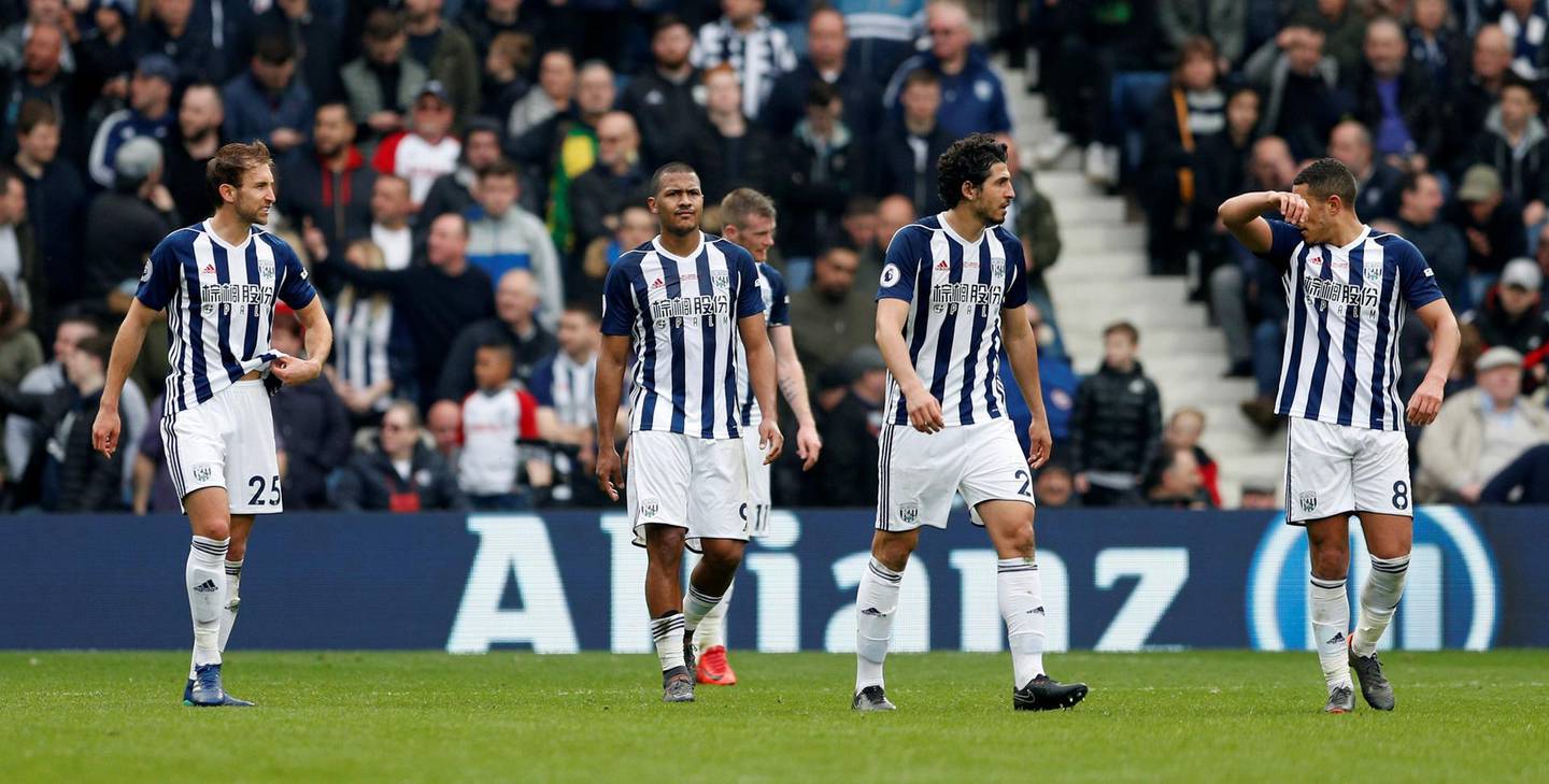 Soccer Football - Premier League - West Bromwich Albion vs Swansea City - The Hawthorns, West Bromwich, Britain - April 7, 2018   West Bromwich Albion's Craig Dawson and team look dejected after conceding their first goal scored by Swansea City's Tammy Abraham                   Action Images via Reuters/Andrew Boyers    EDITORIAL USE ONLY. No use with unauthorized audio, video, data, fixture lists, club/league logos or "live" services. Online in-match use limited to 75 images, no video emulation. No use in betting, games or single club/league/player publications.  Please contact your account representative for further details.