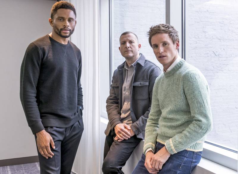 Actors Redmayne, right, and Nnamdi Asomugha, left, with director Tobias Lindholm. AP 