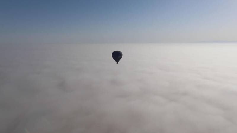 Balloon above the fog. Andy Scott / The National