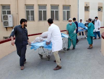 Hospital workers transfer injured people for treatment after a truck bomb blast in Balkh province, in Mazar-i-Sharif, Afghanistan. Reuters