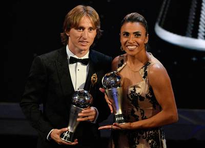 Real Madrid player Luka Modric (L) with the Best FIFA Men's Player award and Brazilian international Marta with the Best FIFA Women's Player award pose during the Best FIFA Football Awards 2018 in London. EPA