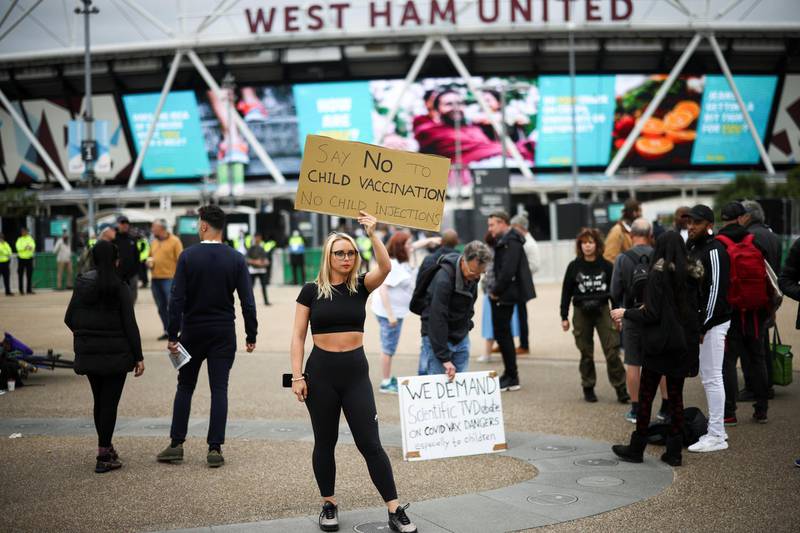 Anti-vaccine protestors gather outside a mass vaccination centre at the London Stadium. Reuters