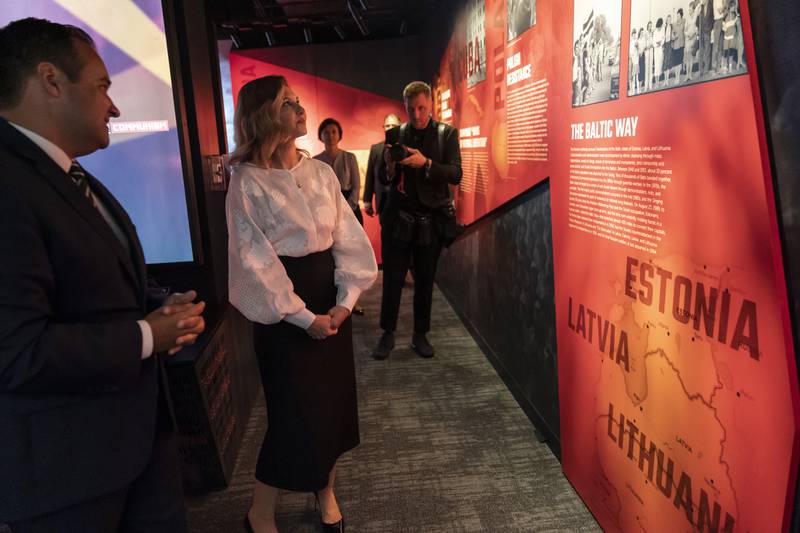 Olena Zelenska, the first lady of Ukraine, tours the Victims of Communism Museum with Andrew Bremberg, President and CEO of the Victims of Communism Memorial Foundation, left. AP