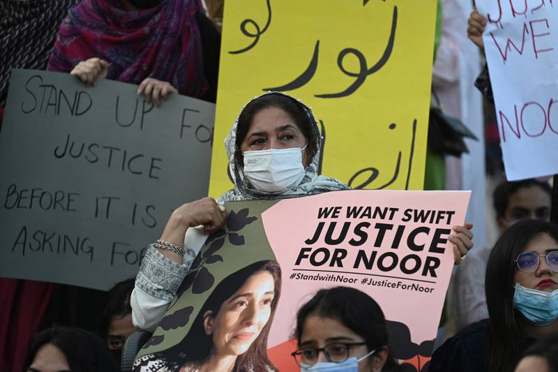 Women rights activists hold placards during a protest rally against the brutal killing of Noor Mukadam, the daughter of a former Pakistani diplomat who was found murdered at a house in Pakistan's capital on July 20, in Islamabad. AFP